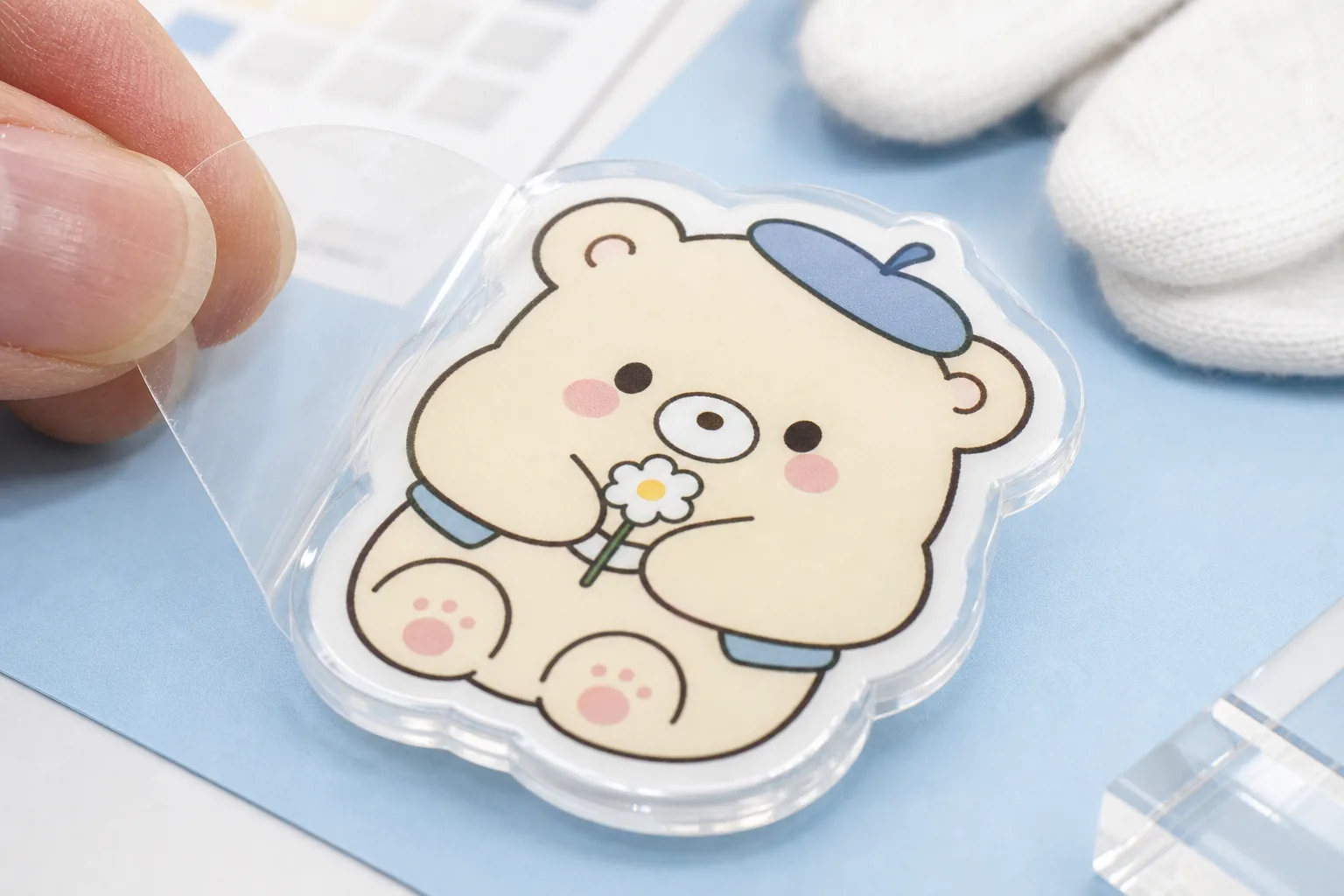 Protective film detail on acrylic badge surface, showing scratch control and UV print finishing for OEM quality checks.