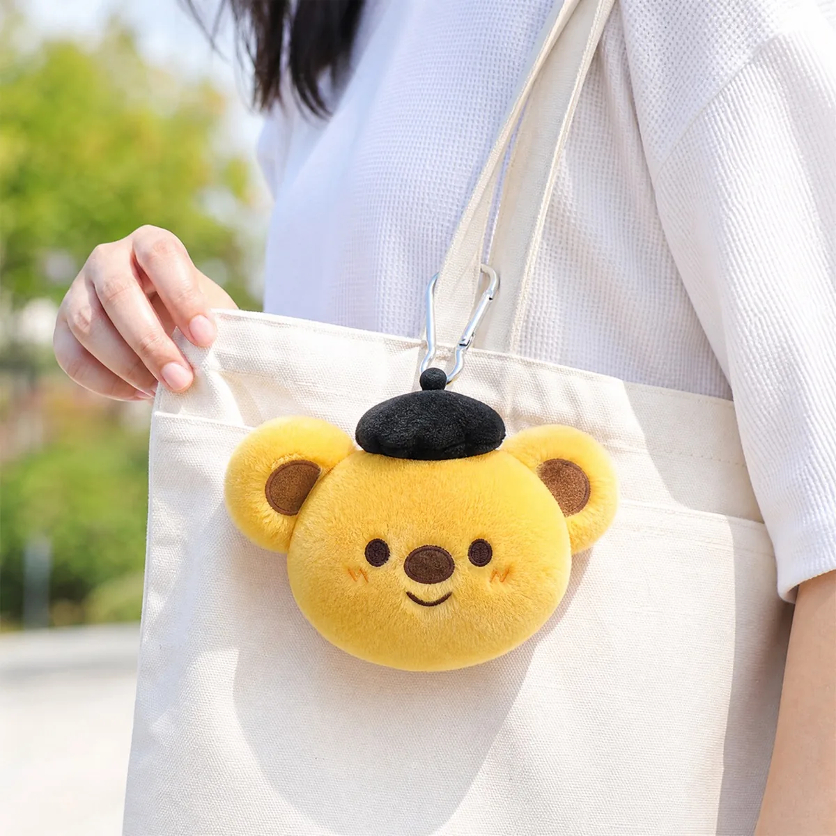 animal face plush charm attached to a tote bag as a campaign giveaway