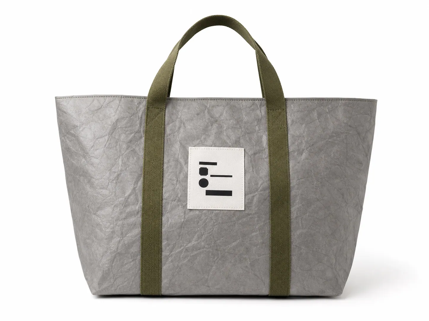 Grey Tyvek-style wide tote bag with olive woven handles and front label