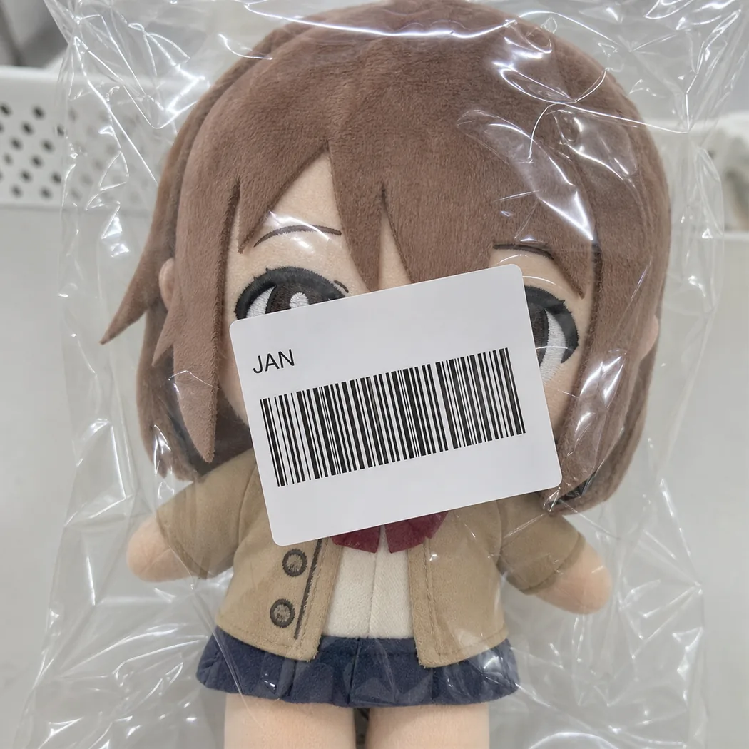 crooked JAN barcode sticker covering the face of a packaged plush toy