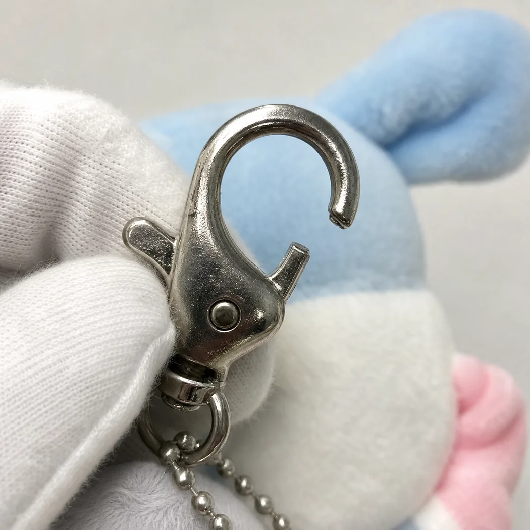 defective lobster clasp stuck open on a plush keychain attachment