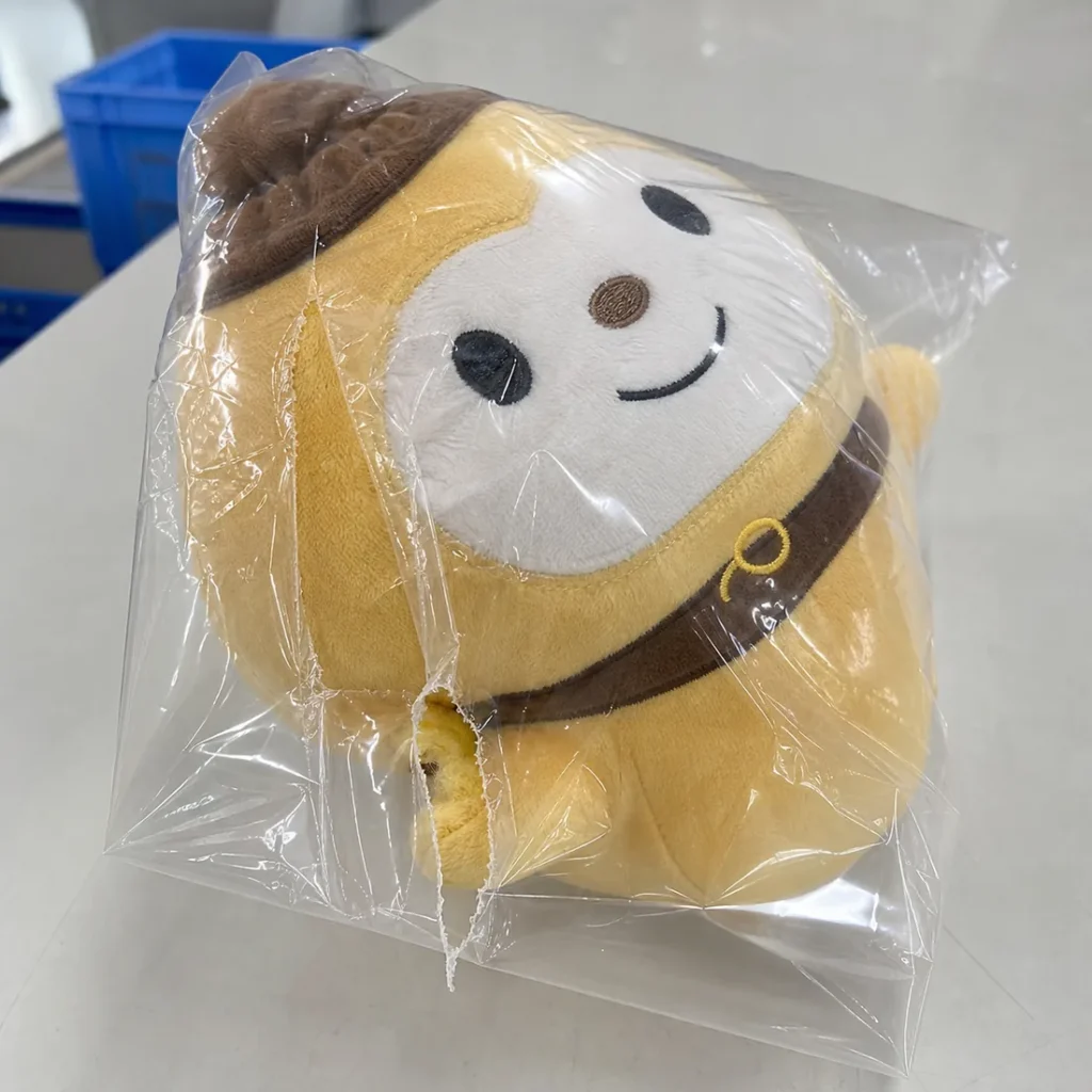 custom plush packed in an undersized OPP bag with a split side seam