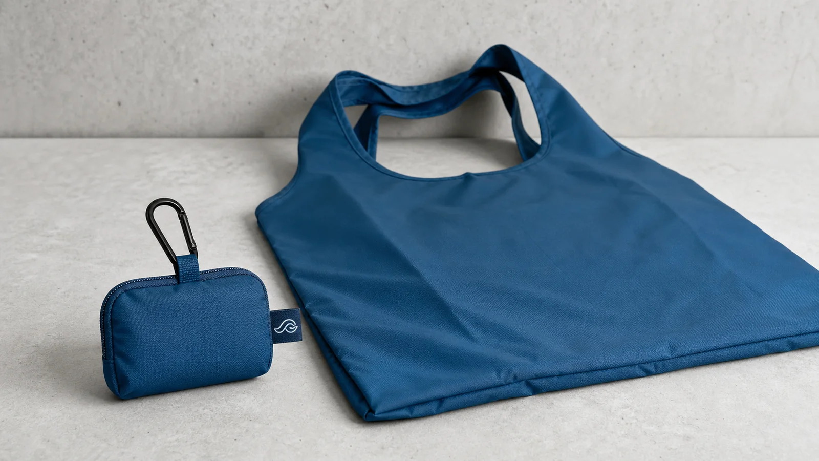 Blue RPET shopping bag with matching zip pouch and carabiner for portable promotional use