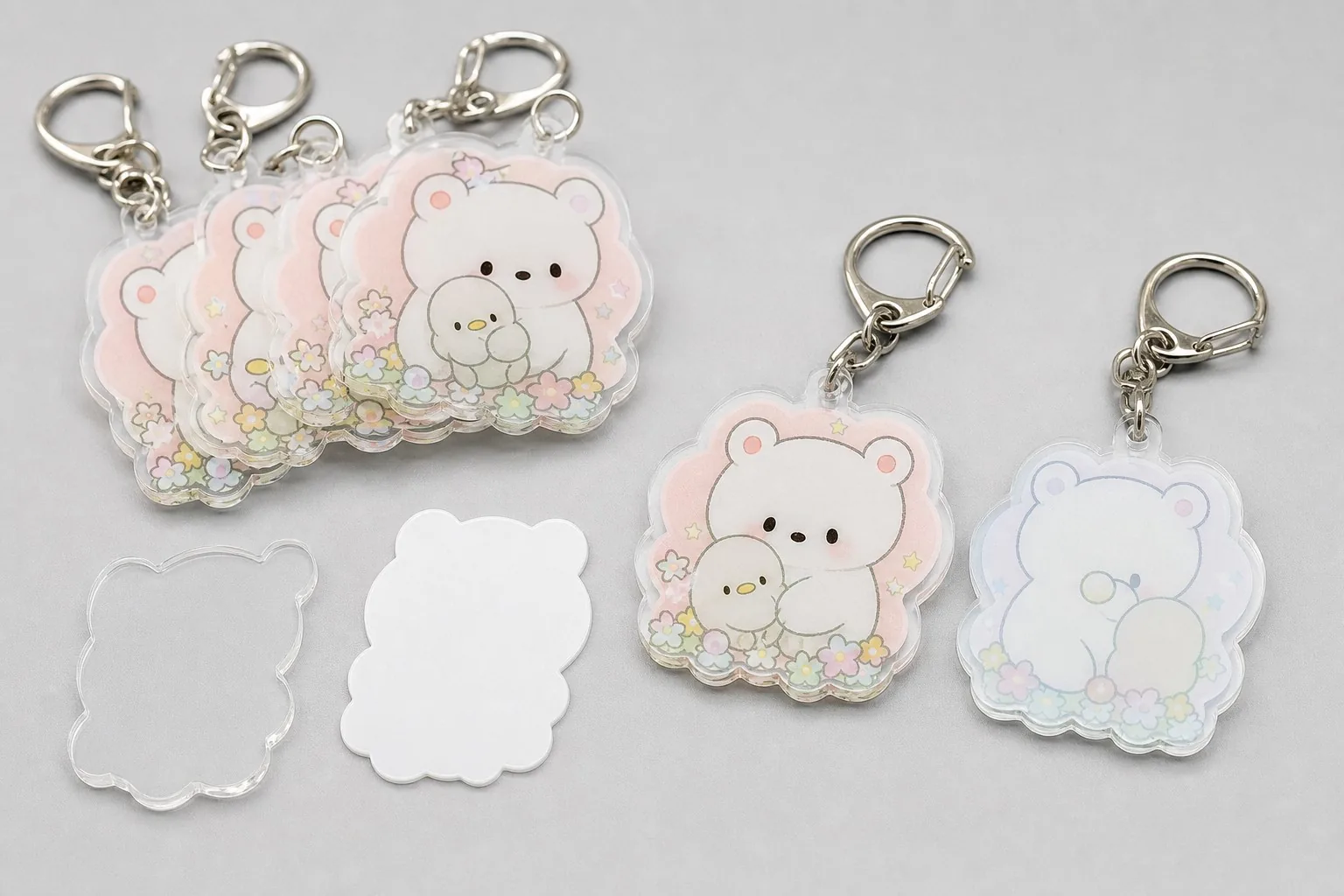 Double-sided acrylic keychains showing clear, white ink and reverse print layers