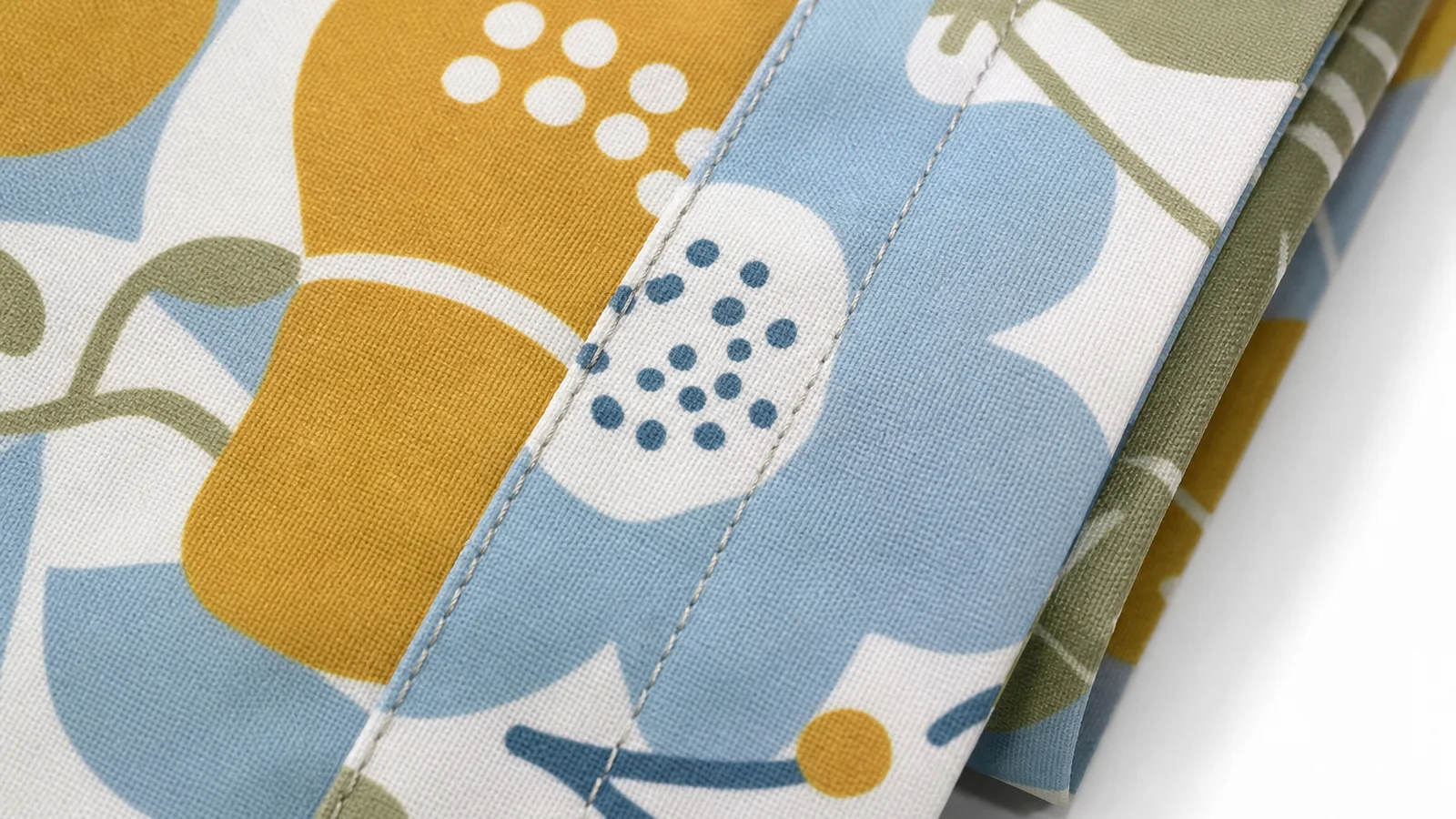 Close-up of an all-over printed foldable bag fabric showing seam alignment and fold marks