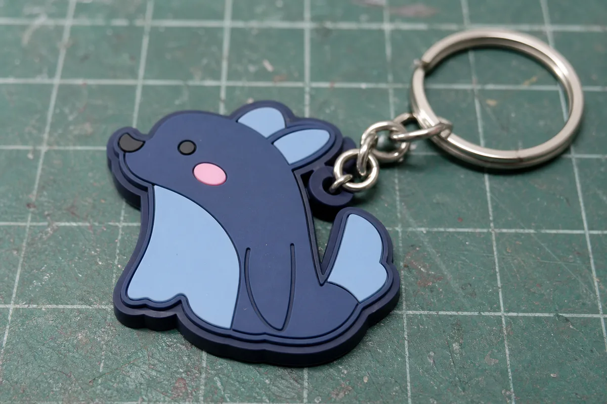 Inspection of 2D layered molding, satin surface and metal ring on a PVC keyring