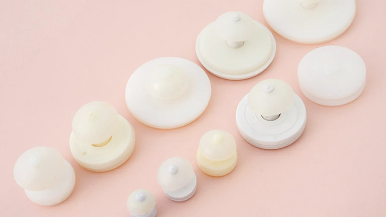 Real doll joint reference used for fixing PVC sofubi face parts to plush bodies.