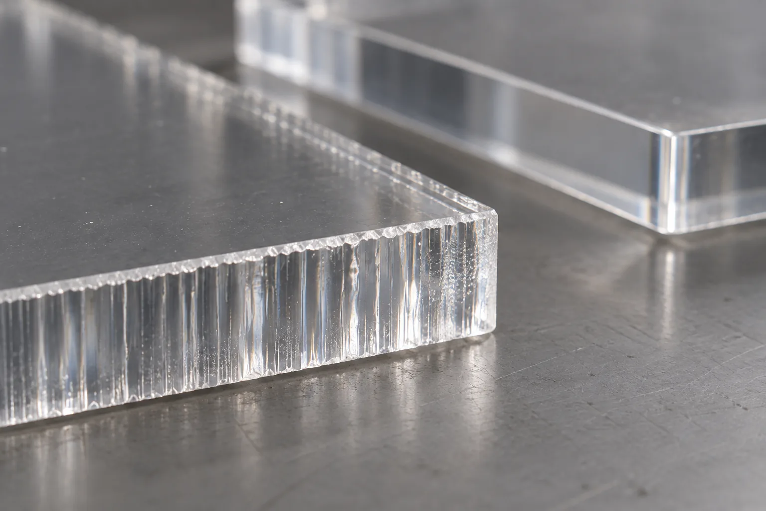 Vertical striations and ripple marks on a laser-cut acrylic edge