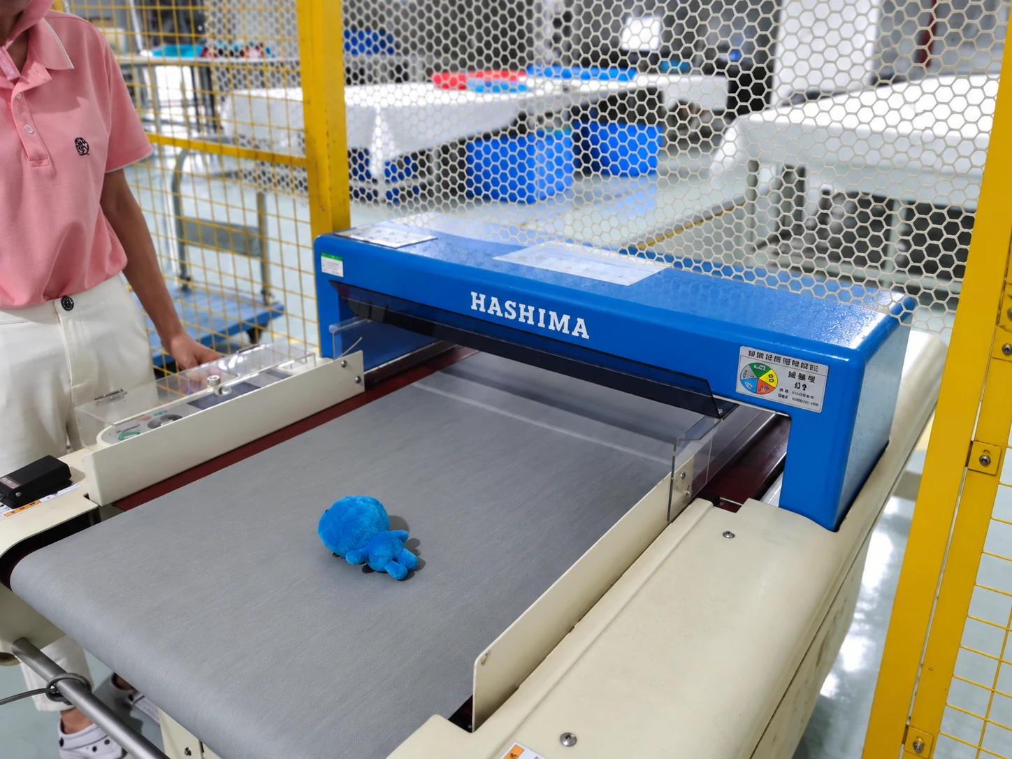 Representative conveyor needle-detection process for plush goods, reconstructed from equipment reference materials