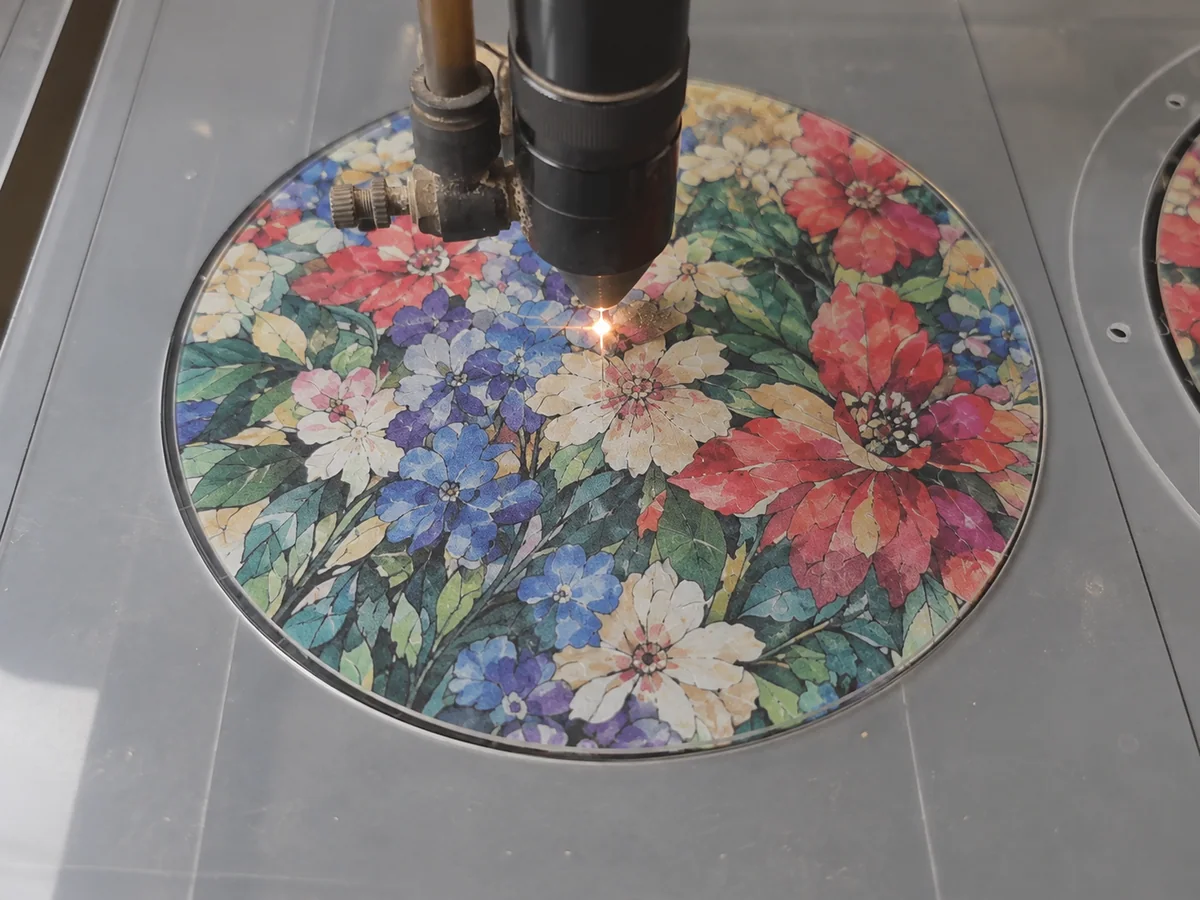 Laser cutting printed acrylic into custom puzzle pieces