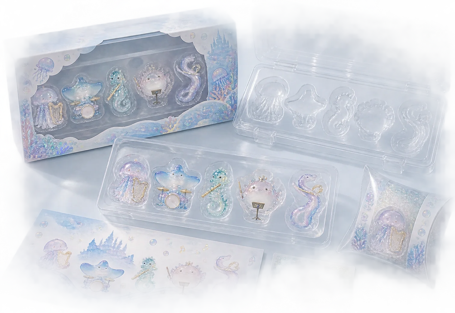 Clear formed trays and blister-style inserts holding small character merchandise