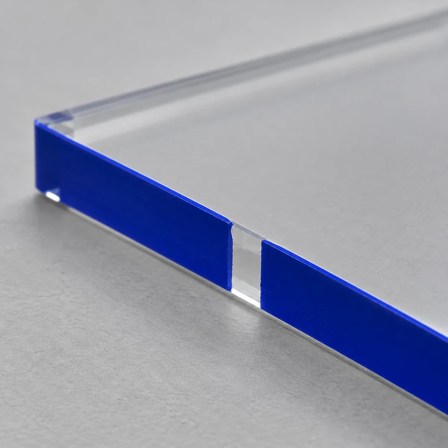 Missed coverage inspection example on the painted edge of clear acrylic