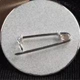 Safety pin attachment for custom zinc alloy badges